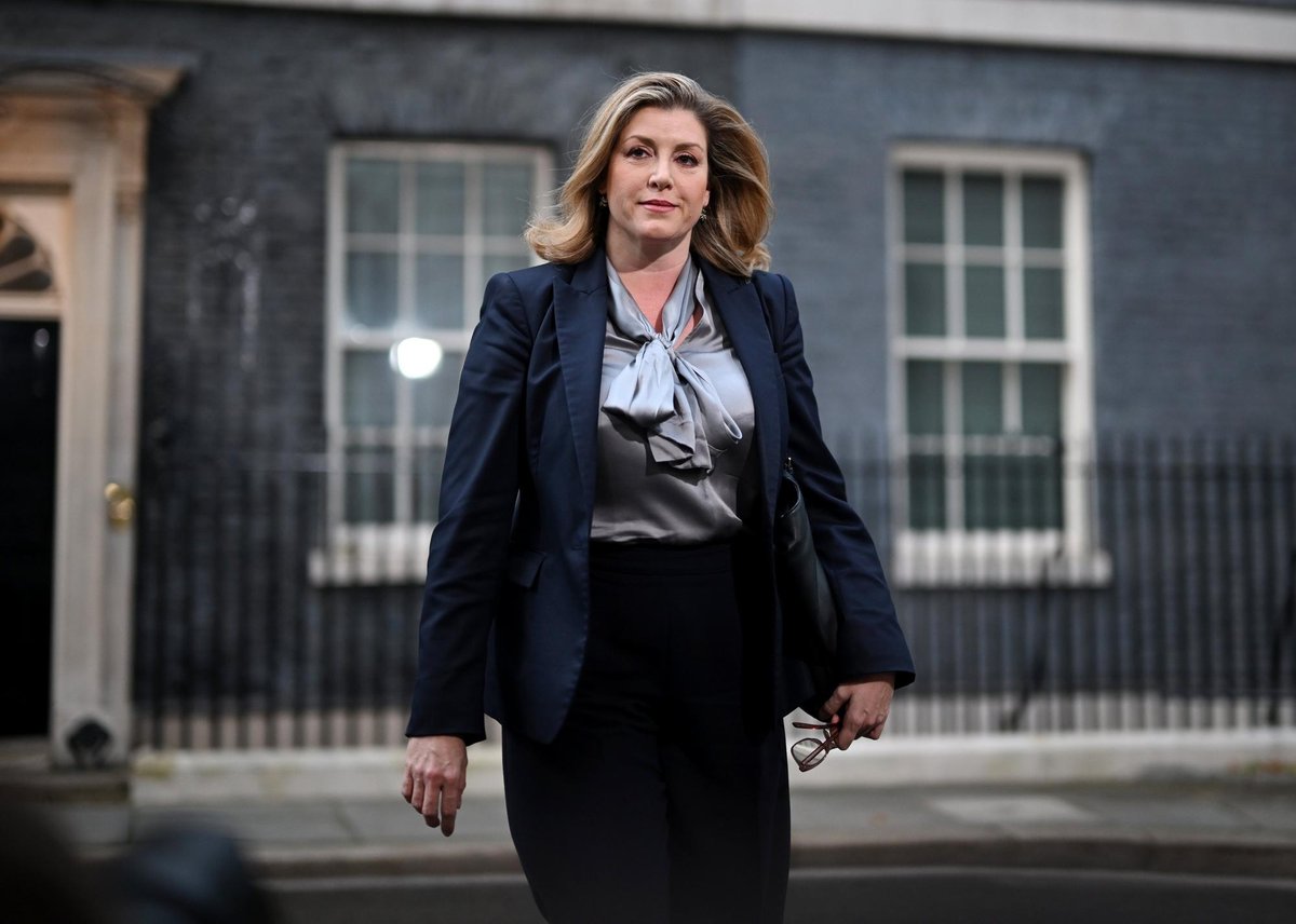 Penny Mordaunt MP walking along Downing Street.